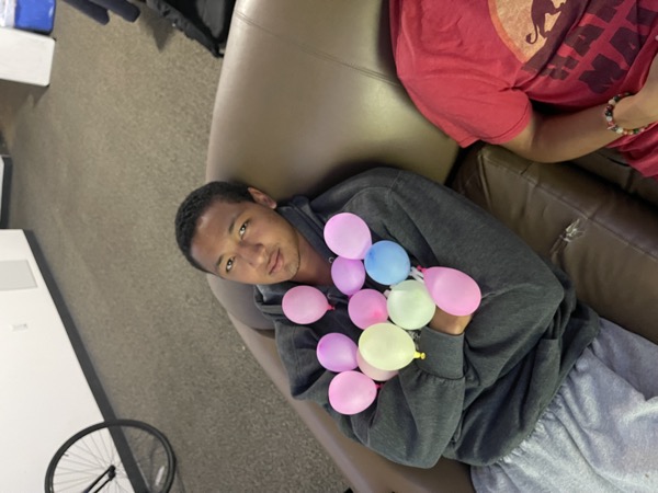 Just a good photo all around. Bryce is holding an obscene amount of small balloons