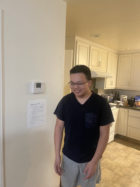 Clarence while standing in front of totally accurate height marks on the wall behind him