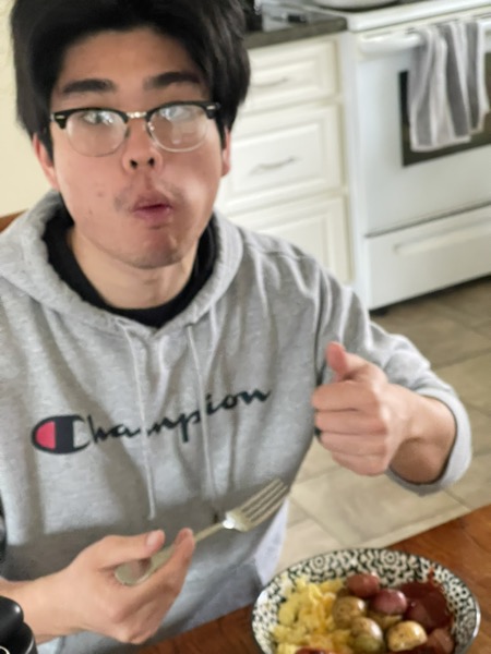 Had to add the boy Jalen to the website, and here he is just trying to enjoy his food