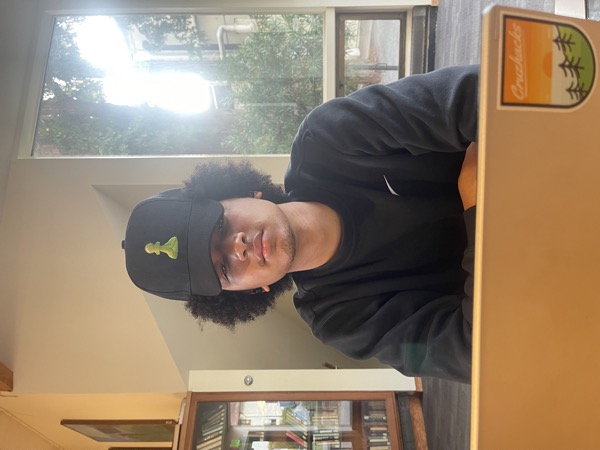 Bryce with poofy hair and a dope ass chess hat